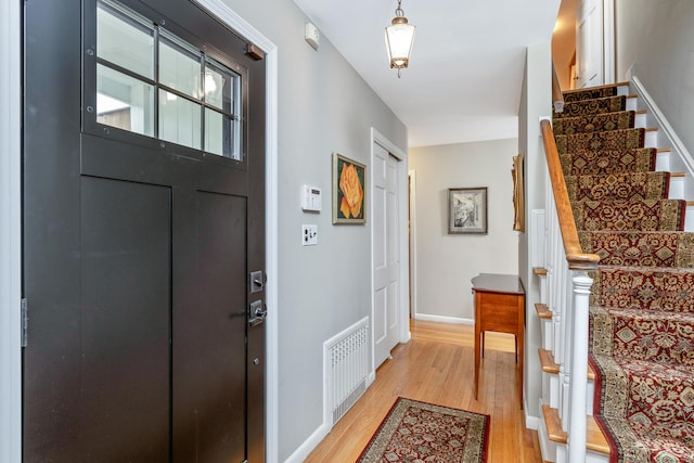 2 The Spout, Smithtown, NY 11787 - entrance foyer with light wood-style floors and stairway