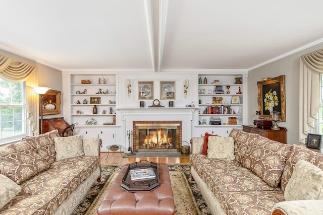 2 The Spout, Smithtown, NY 11787 - living area with healthy amount of natural light, wood finished floors, a fireplace, built in features, and crown molding