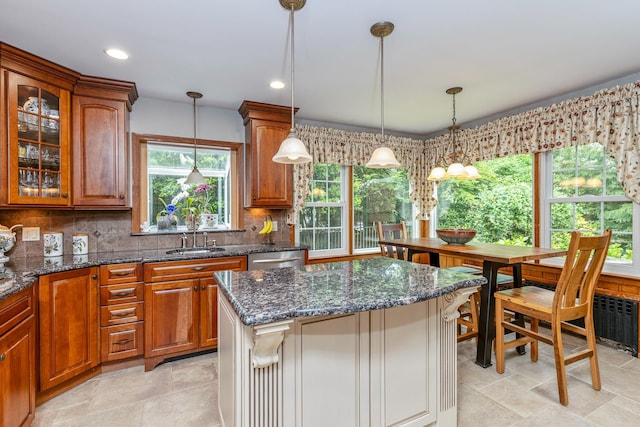 2 The Spout, Smithtown, NY 11787 - kitchen with healthy amount of natural light, brown cabinetry, tasteful backsplash, and recessed lighting