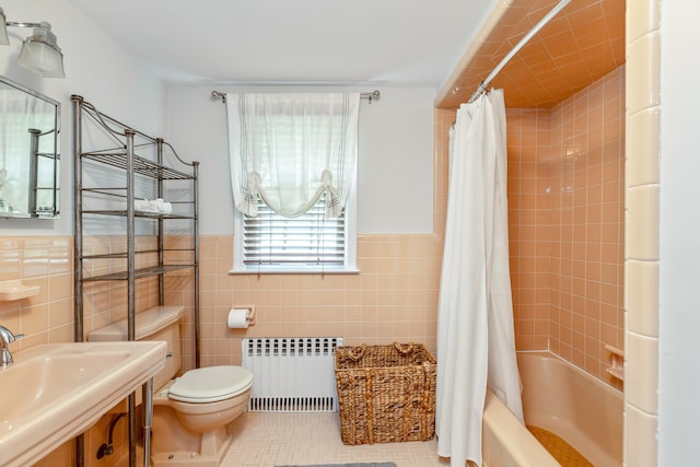 2 The Spout, Smithtown, NY 11787 - bathroom with radiator heating unit, shower / tub combo with curtain, tile walls, tile patterned flooring, and wainscoting