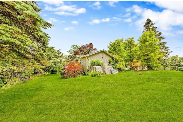 481 E Branch Rd, Patterson, NY 12563 - view of green lawn featuring a playground