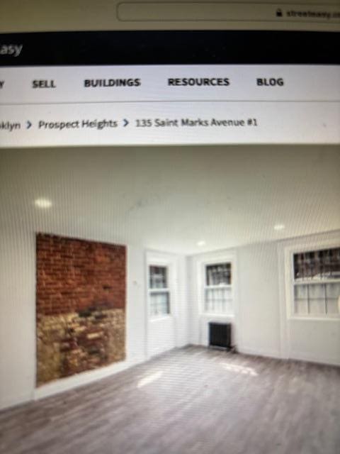 135 Saint Marks Ave, Brooklyn, NY 11217 - unfurnished living room with wood finished floors