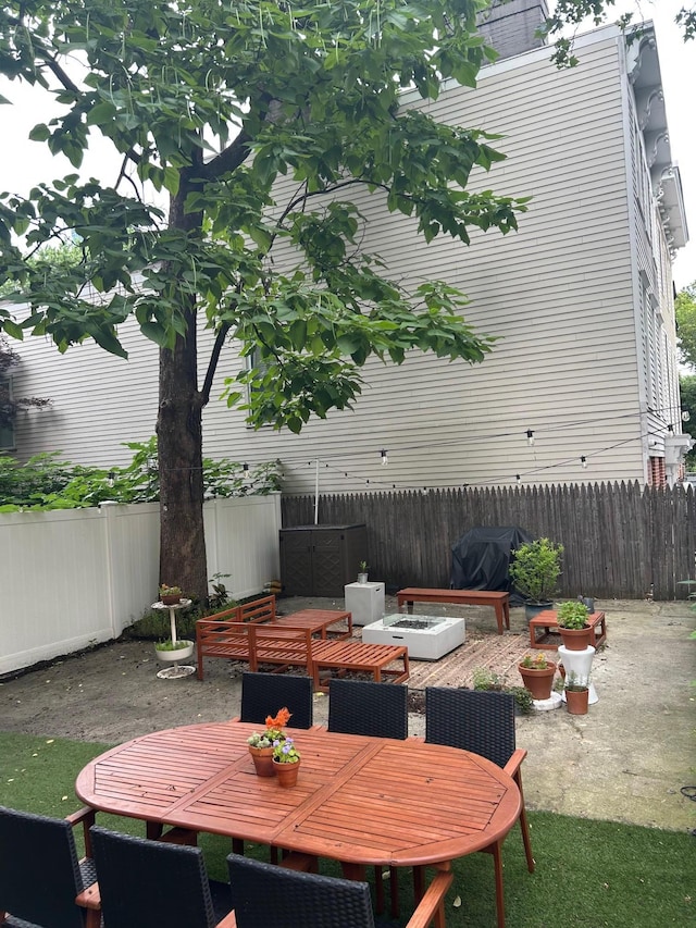 135 Saint Marks Ave, Brooklyn, NY 11217 - fenced backyard with a grill and outdoor dining space