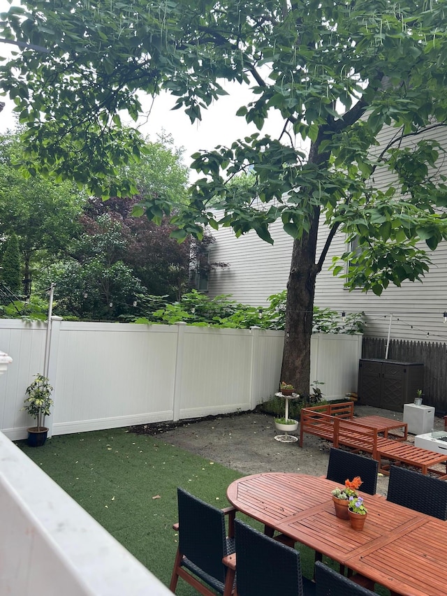 135 Saint Marks Ave, Brooklyn, NY 11217 - fenced backyard with outdoor dining area
