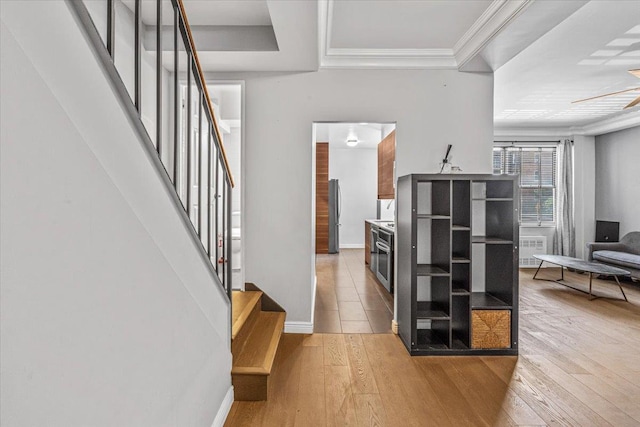 99-40 63rd Rd Unit 1Z, Rego Park, NY 11374 - foyer with light wood-type flooring, stairs, a ceiling fan, radiator, and crown molding