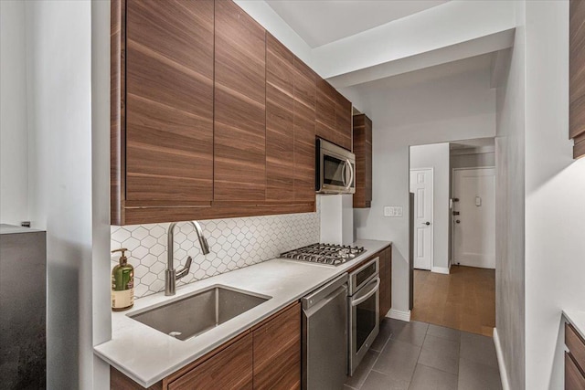 99-40 63rd Rd Unit 1Z, Rego Park, NY 11374 - kitchen with appliances with stainless steel finishes, backsplash, modern cabinets, and dark tile patterned floors