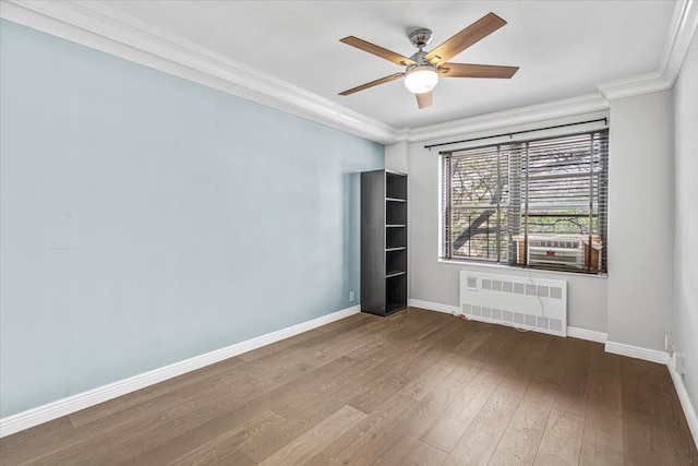 99-40 63rd Rd Unit 1Z, Rego Park, NY 11374 - spare room with radiator heating unit, hardwood / wood-style floors, ceiling fan, and crown molding
