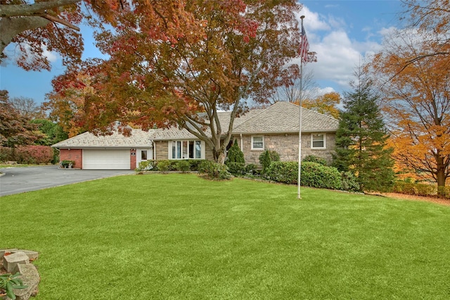 25 Fountain Dr, Valhalla, NY 10595 - view of front of property featuring driveway, a garage, stone siding, and a front lawn