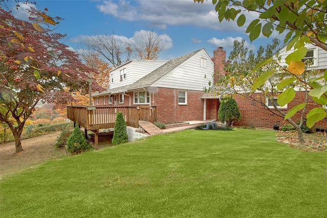 25 Fountain Dr, Valhalla, NY 10595 - rear view of house featuring a deck, brick siding, a yard, and a chimney