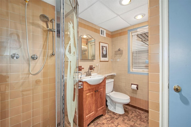 25 Fountain Dr, Valhalla, NY 10595 - full bathroom with a shower stall, vanity, and tile walls