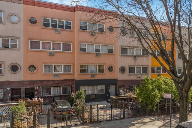1180 Sherman Ave, Bronx, NY 10456 - view of apartment building / complex with a fenced front yard