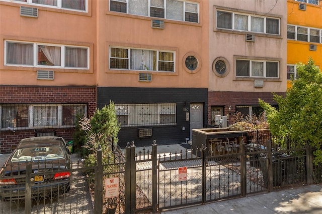 1180 Sherman Ave, Bronx, NY 10456 - view of building exterior with a fenced front yard