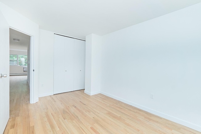 1180 Sherman Ave, Bronx, NY 10456 - unfurnished bedroom featuring wood finished floors, baseboards, and a closet