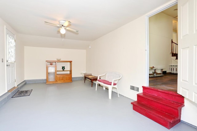 38 Wilson St, Middletown, NY 10940 - sitting room featuring stairs, finished concrete floors, and ceiling fan
