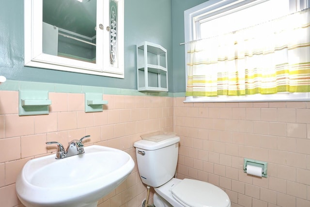 38 Wilson St, Middletown, NY 10940 - half bathroom featuring tile walls and a wainscoted wall