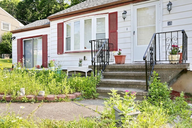 38 Wilson St, Middletown, NY 10940 - property entrance with a shingled roof