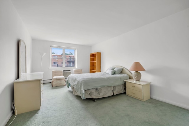 25 Chapel Pl Unit 3N, Great Neck, NY 11021 - bedroom featuring light carpet, a baseboard heating unit, and baseboards