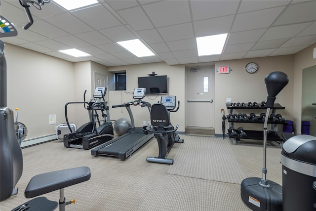 25 Chapel Pl Unit 3N, Great Neck, NY 11021 - gym with carpet, a paneled ceiling, baseboards, and a baseboard heating unit