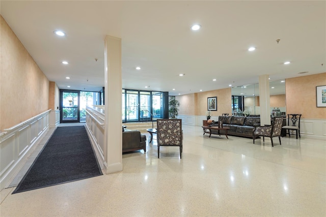 25 Chapel Pl Unit 3N, Great Neck, NY 11021 - community lobby with a decorative wall, a wainscoted wall, and recessed lighting