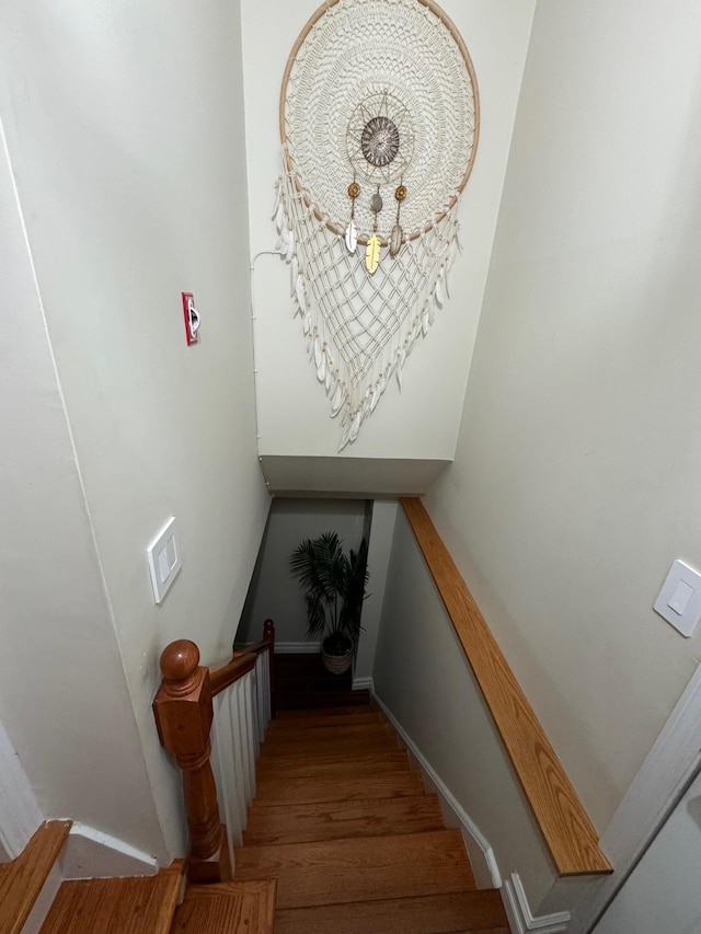 1803 Front St, East Meadow, NY 11554 - staircase with wood finished floors and baseboards