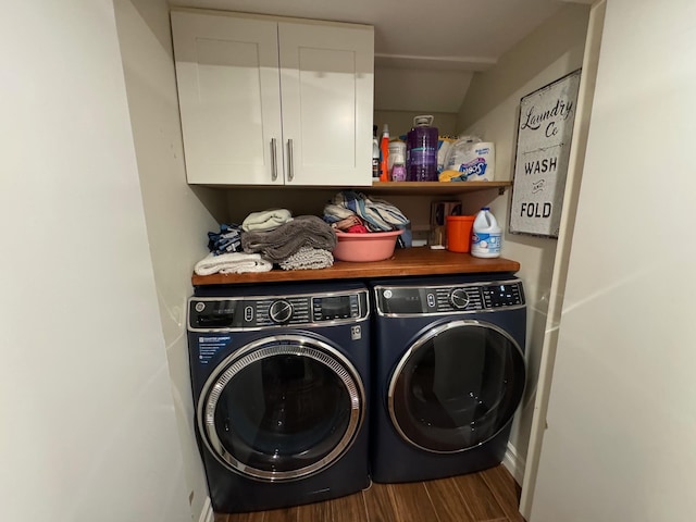 1803 Front St, East Meadow, NY 11554 - laundry area with washing machine and dryer, cabinet space, and wood finished floors