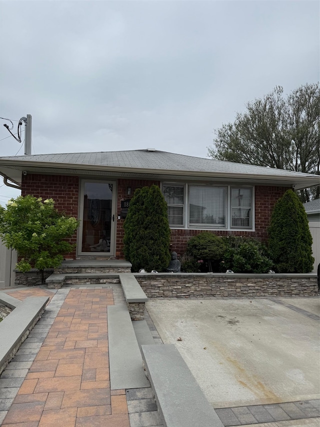 1803 Front St, East Meadow, NY 11554 - view of front facade featuring brick siding