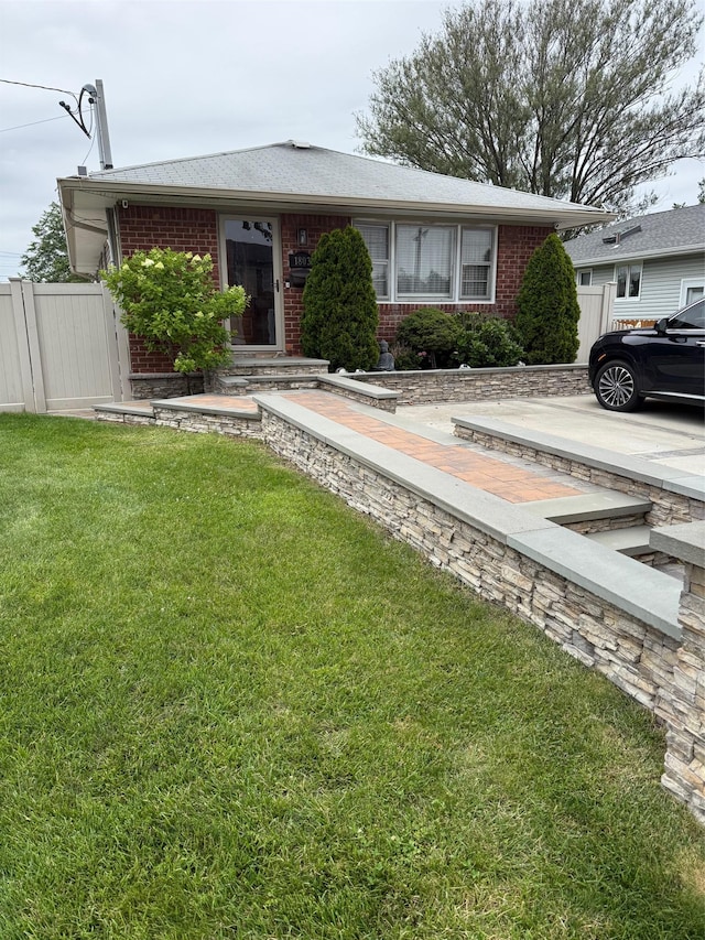 1803 Front St, East Meadow, NY 11554 - view of front of house with brick siding