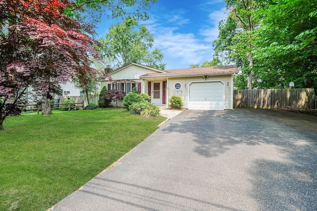 21 Spectacle Lake Dr, Smithtown, NY 11767 - view of front of home with driveway and an attached garage