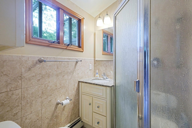 21 Spectacle Lake Dr, Smithtown, NY 11767 - bathroom with a shower stall, vanity, wainscoting, tile walls, and a baseboard radiator