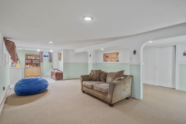 21 Spectacle Lake Dr, Smithtown, NY 11767 - living area featuring light carpet, recessed lighting, and arched walkways