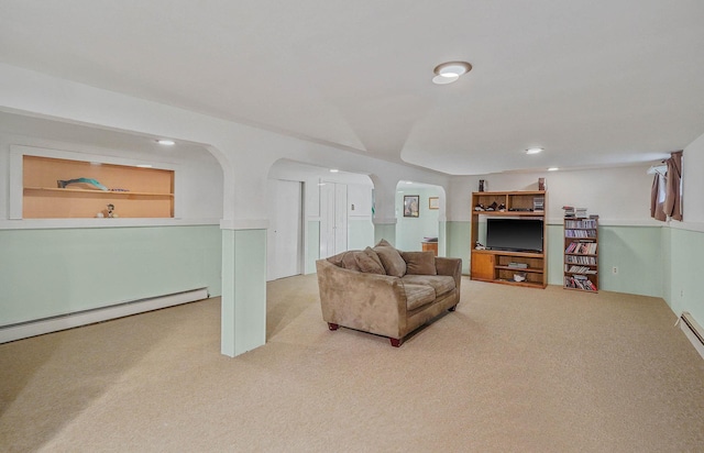 21 Spectacle Lake Dr, Smithtown, NY 11767 - carpeted living room featuring arched walkways, a baseboard heating unit, and recessed lighting