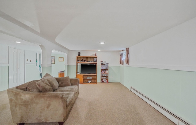 21 Spectacle Lake Dr, Smithtown, NY 11767 - living area featuring baseboard heating, carpet floors, arched walkways, and recessed lighting