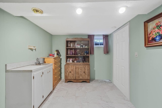 21 Spectacle Lake Dr, Smithtown, NY 11767 - bar area with a sink and light marble finish flooring