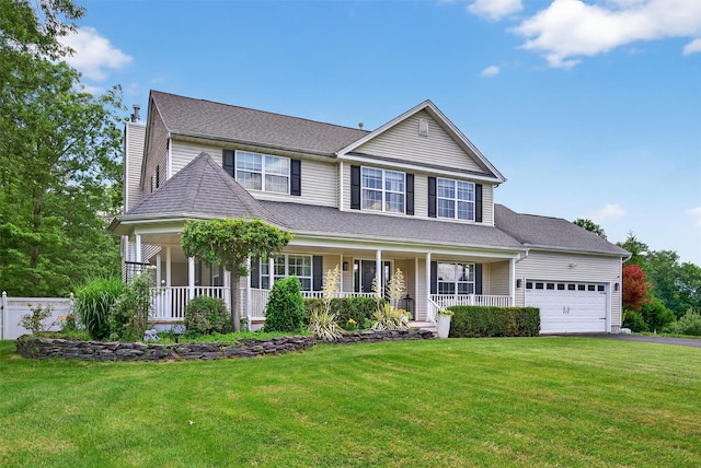 11 Pacer Ct, Goshen, NY 10924 - view of front of home featuring covered porch, a garage, a front yard, and asphalt driveway