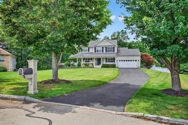 11 Pacer Ct, Goshen, NY 10924 - view of front facade with an attached garage, asphalt driveway, and a porch