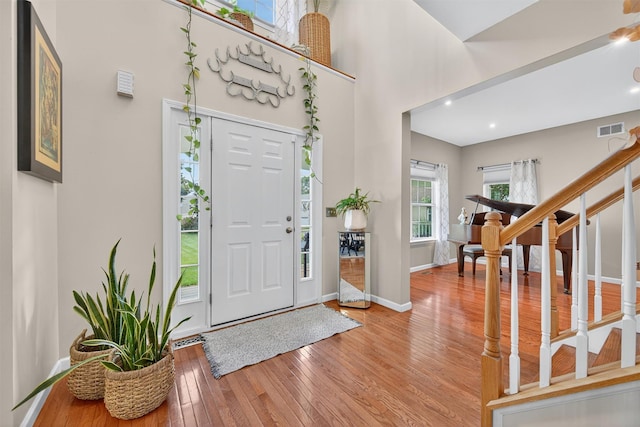 11 Pacer Ct, Goshen, NY 10924 - foyer entrance with hardwood / wood-style flooring, stairs, and a high ceiling