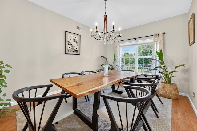 11 Pacer Ct, Goshen, NY 10924 - dining area featuring light wood finished floors and a chandelier