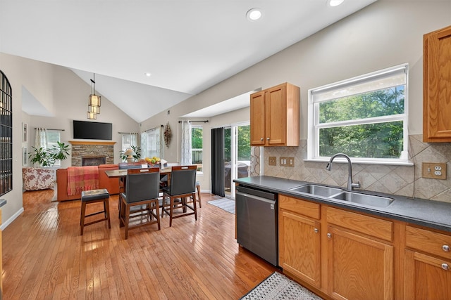 11 Pacer Ct, Goshen, NY 10924 - kitchen featuring dishwasher, light wood-style floors, lofted ceiling, dark countertops, and open floor plan