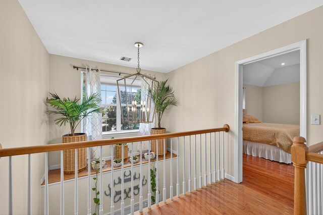 11 Pacer Ct, Goshen, NY 10924 - corridor with wood finished floors and a chandelier