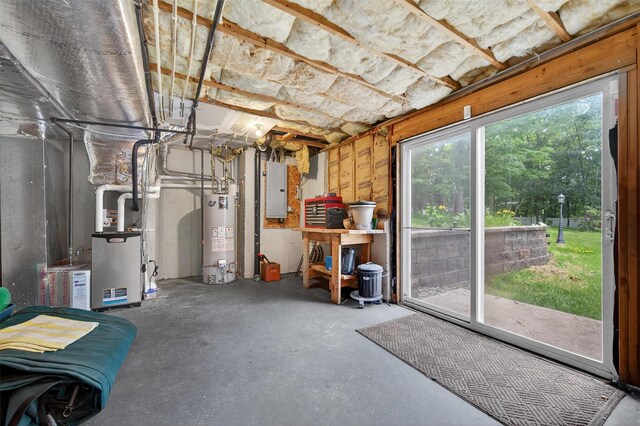 11 Pacer Ct, Goshen, NY 10924 - basement featuring gas water heater, electric panel, and heating unit