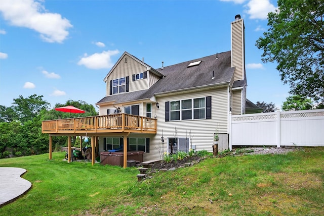 11 Pacer Ct, Goshen, NY 10924 - back of house with a hot tub, a deck, and a chimney