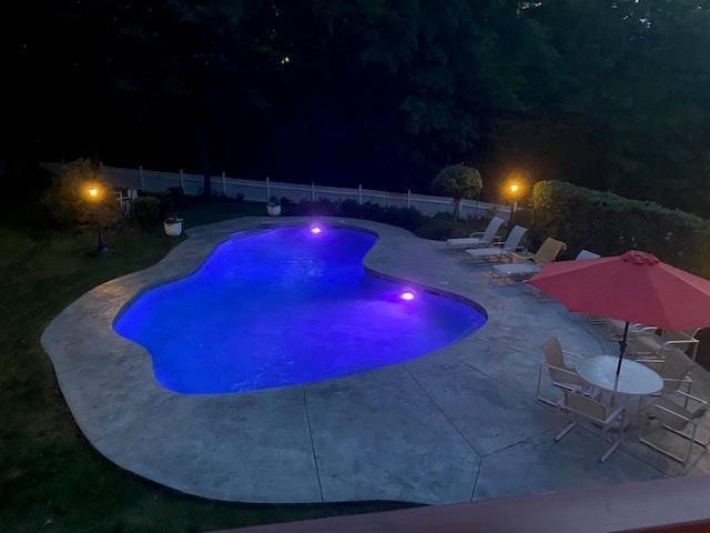 11 Pacer Ct, Goshen, NY 10924 - pool at night featuring a patio