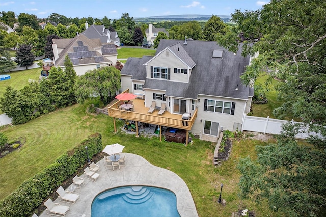 11 Pacer Ct, Goshen, NY 10924 - back of house with a deck, a fenced backyard, outdoor dining space, a patio, and roof with shingles