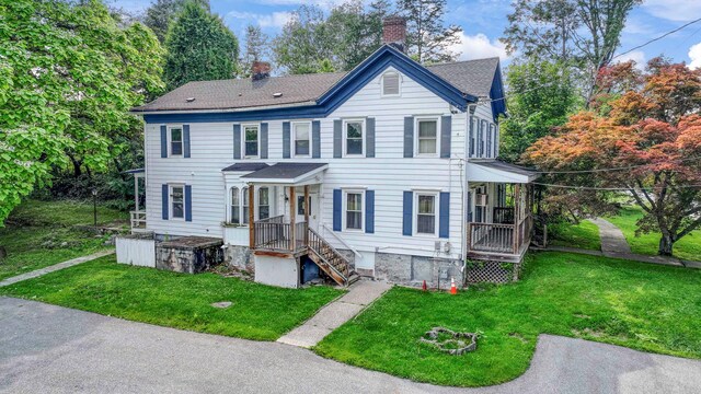 265 Goodwill Rd, Montgomery, NY 12549 - view of front of home with a chimney, a front yard, and a shingled roof