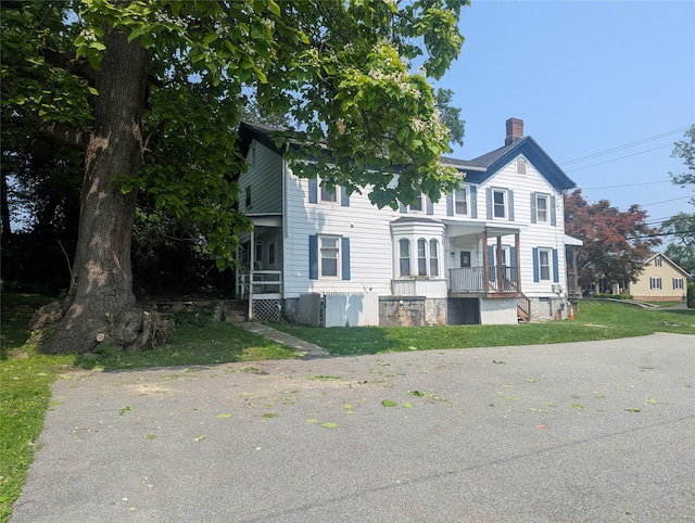 265 Goodwill Rd, Montgomery, NY 12549 - view of front of house with a chimney and a front lawn