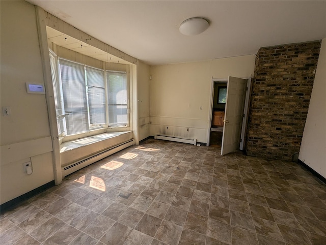 265 Goodwill Rd, Montgomery, NY 12549 - empty room with a baseboard heating unit and stone finish flooring