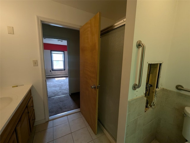 265 Goodwill Rd, Montgomery, NY 12549 - bathroom featuring tile patterned flooring, vanity, and an enclosed shower