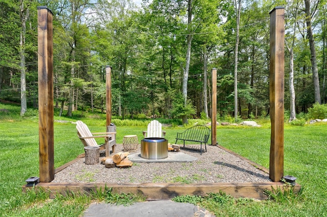 69 Akeson Rd, Glen Spey, NY 12737 - view of grassy yard featuring an outdoor fire pit