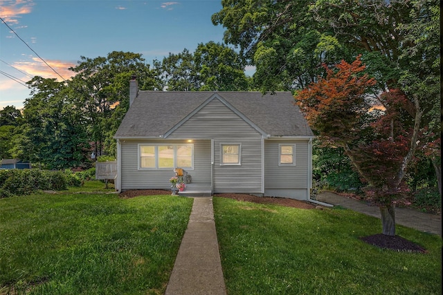 26 Helena Ave, Mohegan Lake, NY 10547 - bungalow-style house featuring a front yard, a chimney, covered porch, and roof with shingles