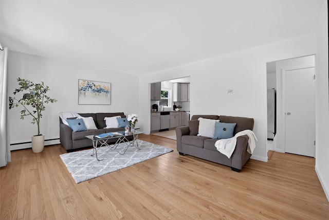 26 Helena Ave, Mohegan Lake, NY 10547 - living area with light wood-style floors and baseboard heating